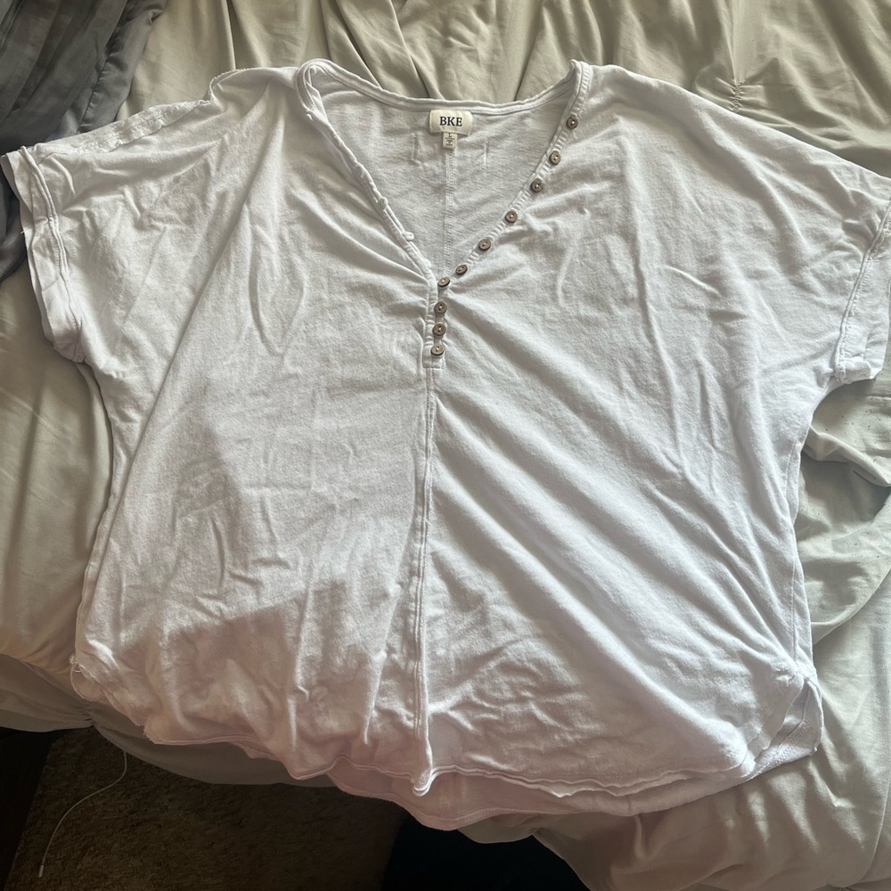Buckle off the shoulder, button up top